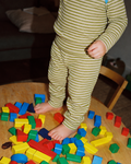 Green and cream striped Whippet baby leggings with a close, flexible fit