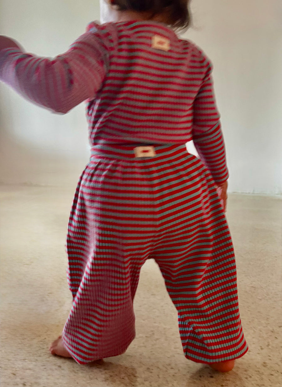 Red and aqua striped Pickle baby balloon pants with a rounded silhouette and gathered ankle cuffs