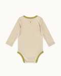 Cream Wren baby bodysuit with green trim, back view