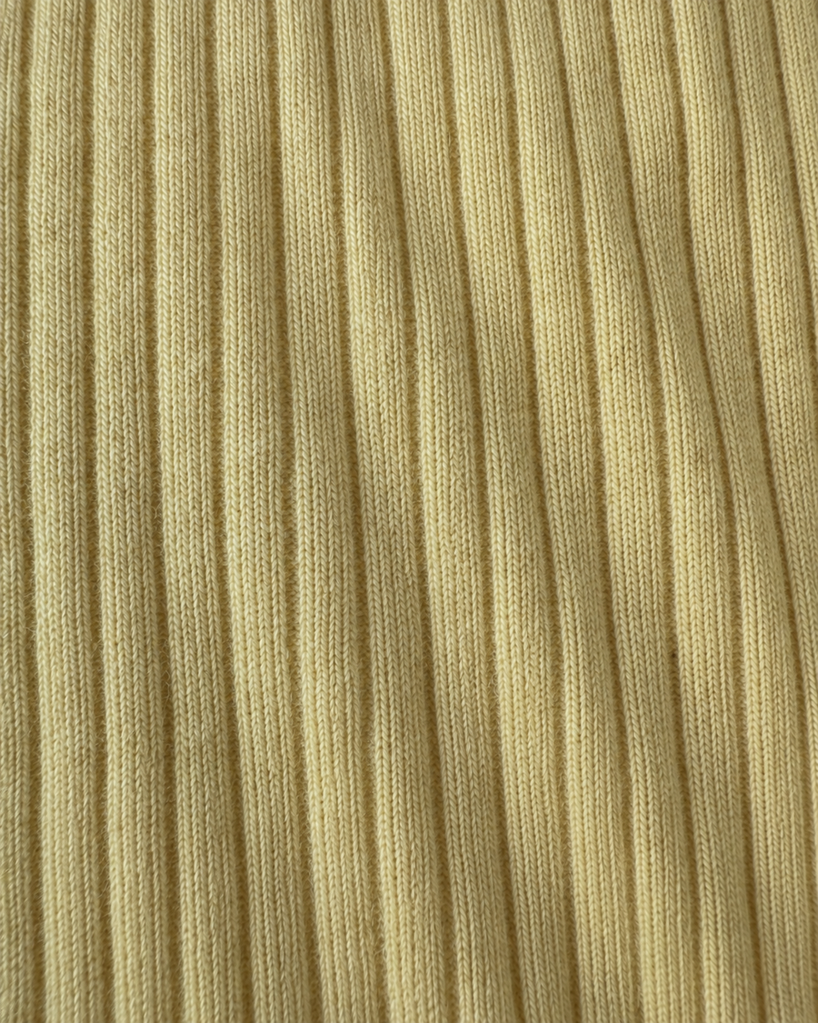Close-up of the yellow Pima cotton and baby alpaca rib knit on the Ravioli tee